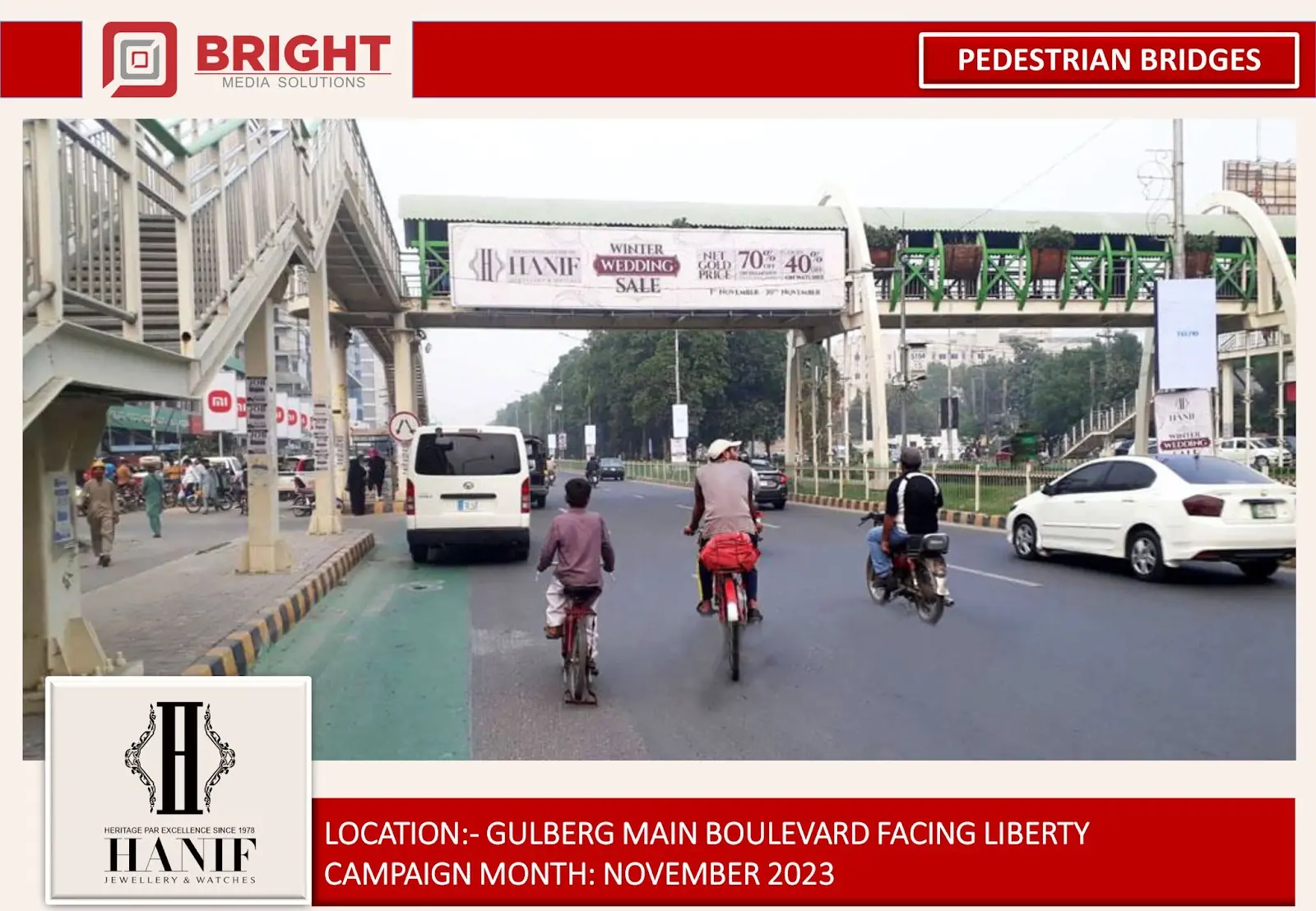Hanif winter wedding sale on a pedestrian bridge above traffic on Gulberg Main Boulevard